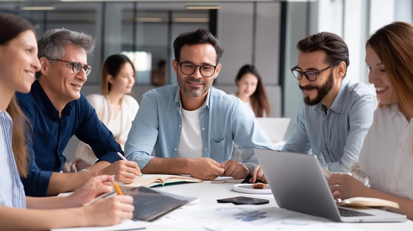 A team discussing data insights during a transformation workshop, reviewing dashboards and metrics together.