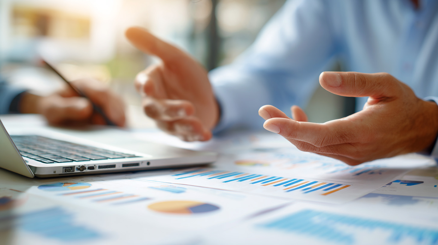 data, chart on the table with a person with open palms