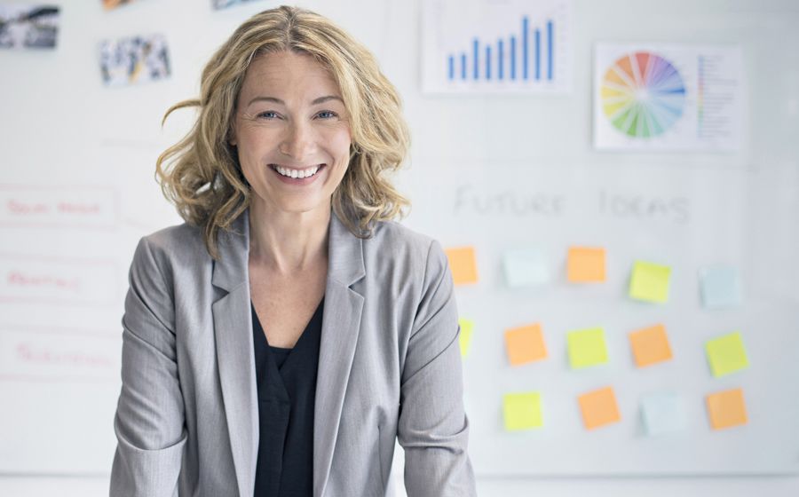 A lady with sticky notes in the background
